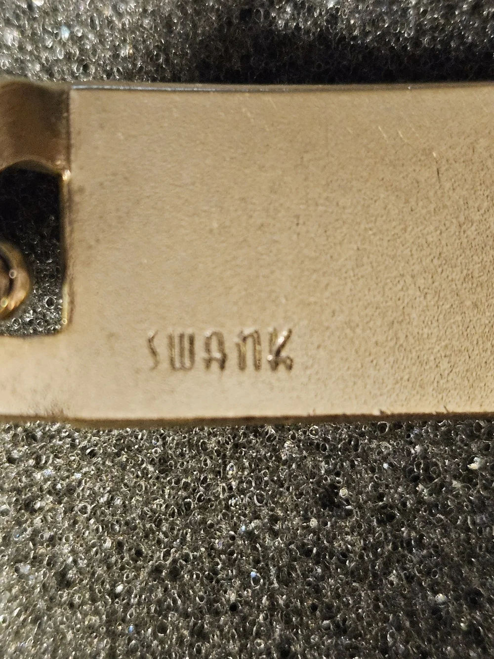 Vintage gold-tone curb-link ID bracelet signed SWANK on the Back identification